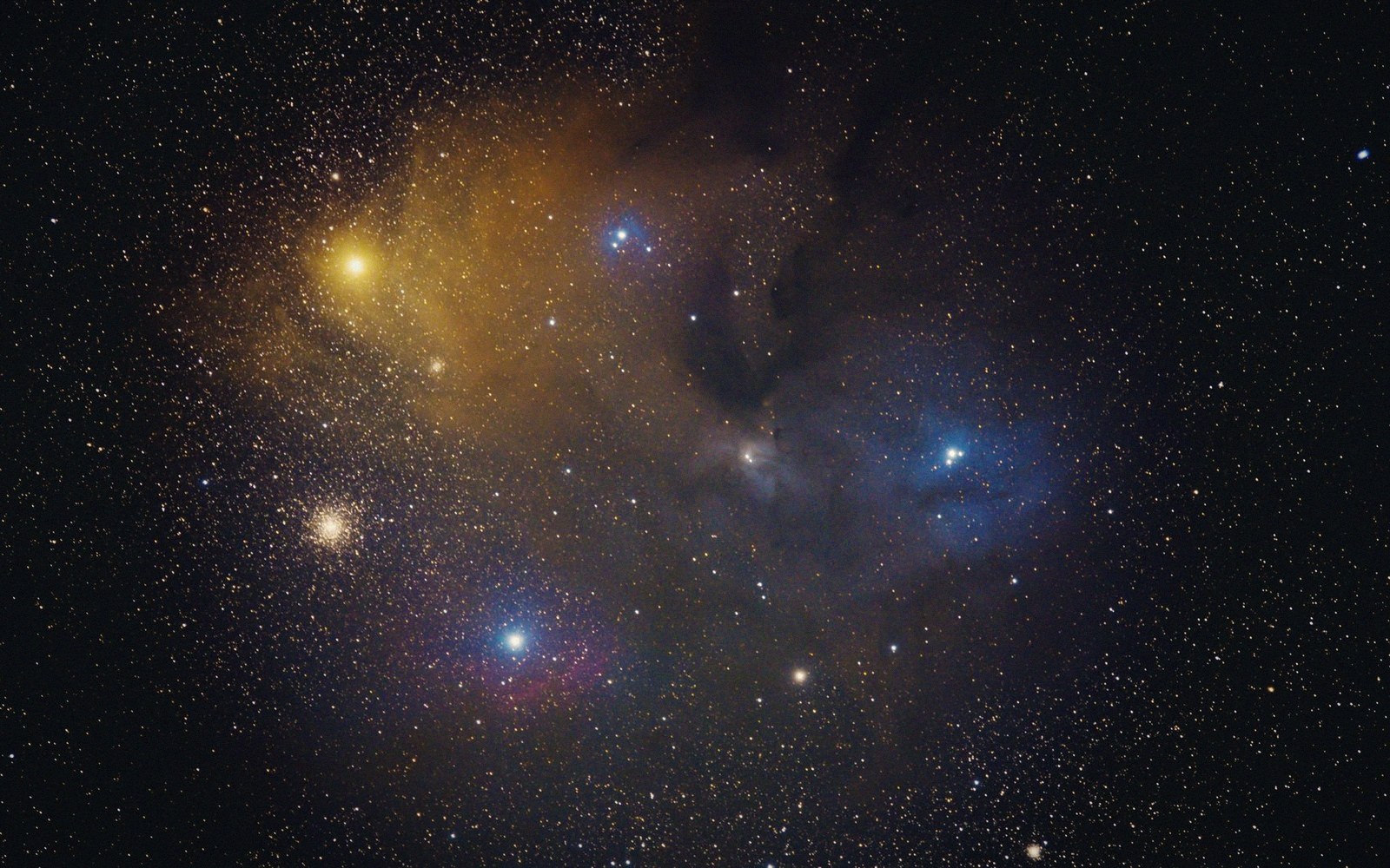 Colorful nebula and star cluster surrounded by dense clouds of dust and gas
